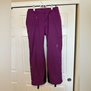 Spyder insulated, waterproof ski pants for women in magenta/purple
